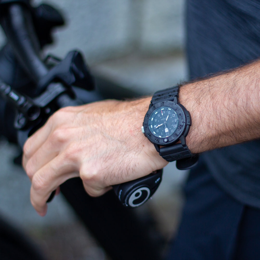 Lifestyle display layout for the Luminox Canada Navy SEAL 3001.EVO.BO.S Swiss Watch. The Original Luminox Navy SEAL watch, first introduced in 1994, is the timepiece that put Luminox on the map.