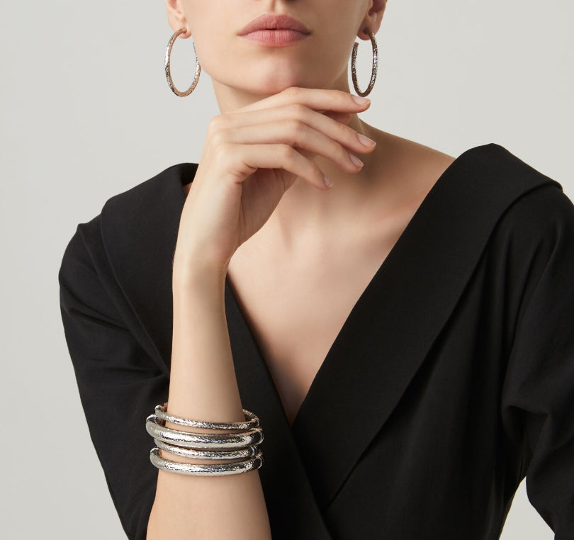 Close-up perspective of the Giovanni Raspini Rock Big Bangle highlighting the texture and design. Bold and sculptural, this piece makes a statement while maintaining the timeless elegance of genuine silver.