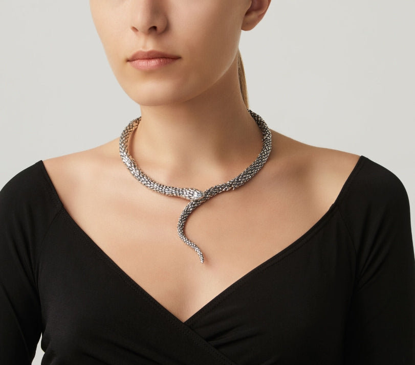 Detailed craftsmanship view of the Giovanni Raspini Snake Necklace. The polished silver catches light beautifully, creating a striking statement piece that works equally well layered or worn alone.