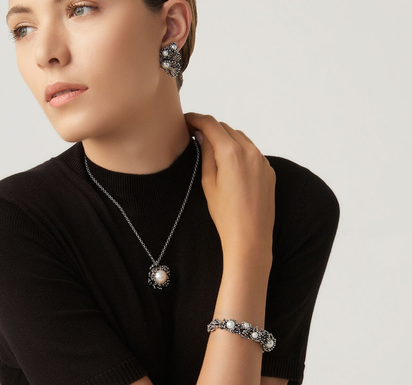 Close-up perspective of the Giovanni Raspini Anemone Pendant Necklace highlighting the texture and design. Versatile and refined, this necklace adds understated luxury to any wardrobe.